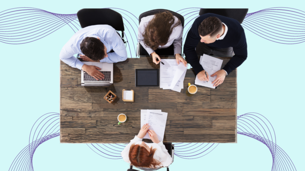 A blue background with with purple wave lines coming from each corner. In the middle a table with 3 people on 1 side and 1 on the other side.