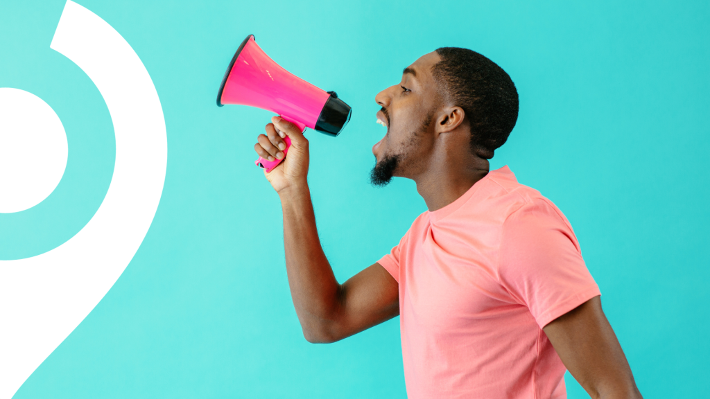 events lead for a charity northeast company. Man with megaphone.